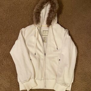 Zip up hoodie trimmed in fur with fleece lining